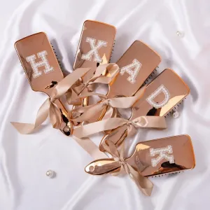 monogram metallic hair brushes
