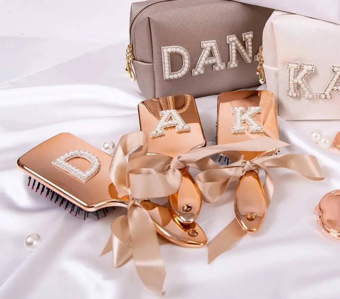 monogram metallic hair brushes