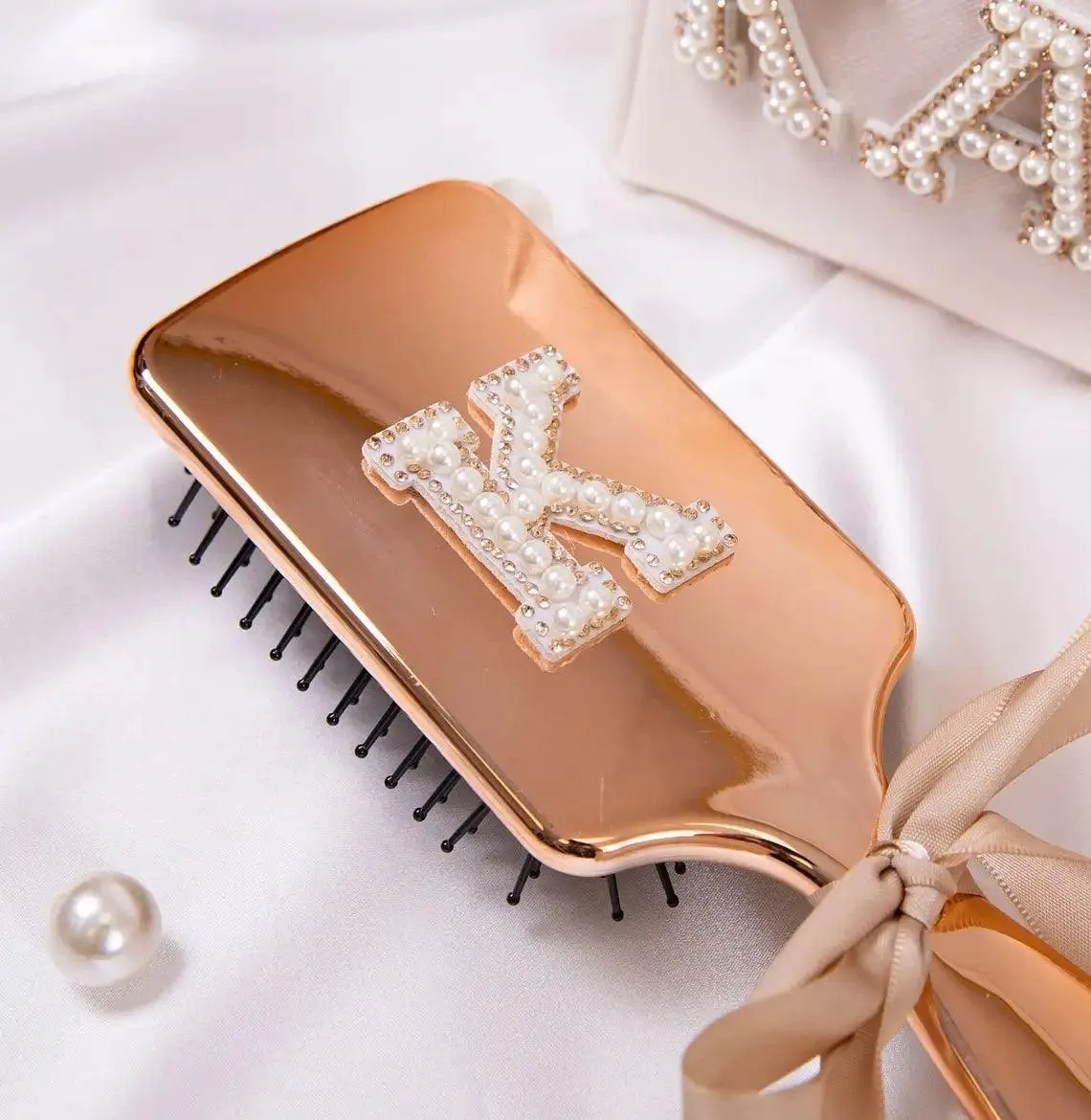 monogram metallic hair brushes
