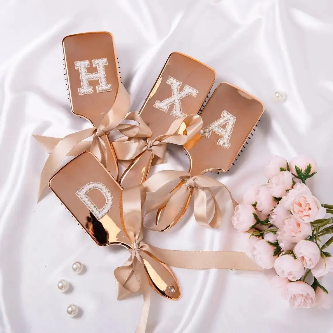 monogram metallic hair brushes